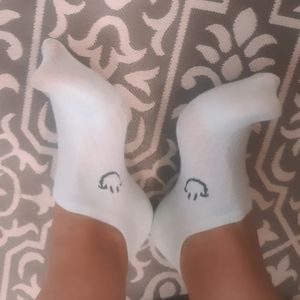 Worn baby blue thin white no show socks